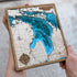 Layered wood Lake Huron wall art showing islands and harbors